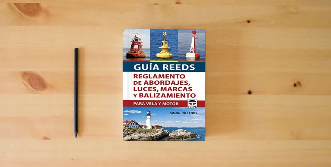 The book Guía REEDS reglamento de abordajes, luces, marcas y balizamiento: Para vela y motor (SIN COLECCION)} is on the table