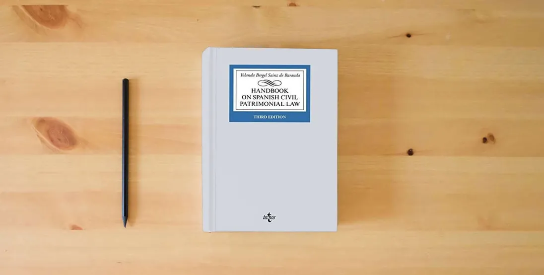 The book Handbook on Spanish Civil Patrimonial Law (Derecho - Biblioteca Universitaria de Editorial Tecnos)} is on the table