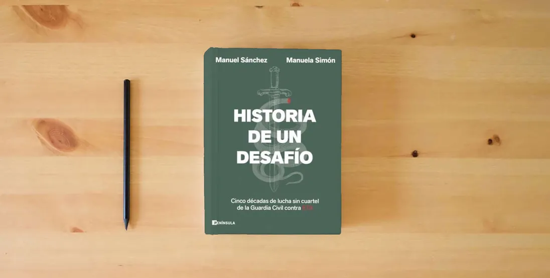 The book Historia de un desafío: Cinco décadas de lucha sin cuartel de la Guardia Civil contra ETA (PENINSULA)} is on the table