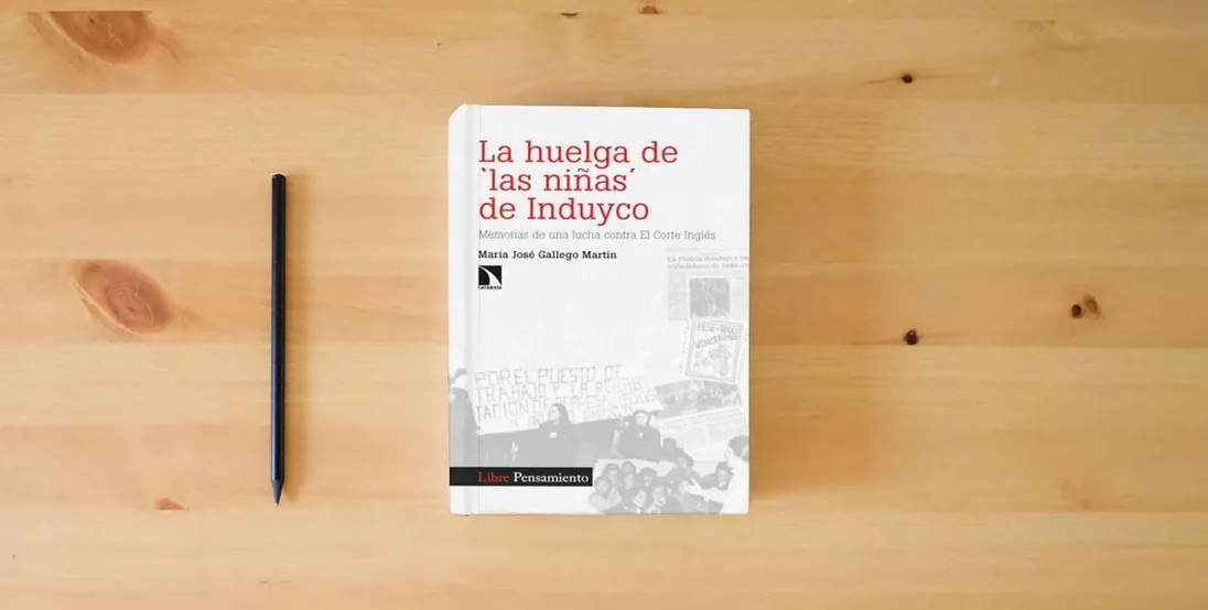 The book La huelga de 'las niñas' de Induyco: Memorias de una lucha contra El Corte Inglés: 430 (INVESTIGACION Y DEBATE)} is on the table