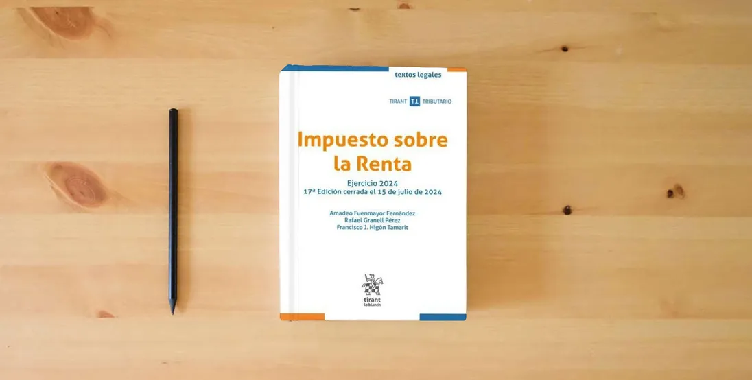 The book Impuesto sobre la Renta Ejercicio 2024 17ª Edición cerrada el 15 de julio de 2024 (Textos legales Tirant Tributario)} is on the table