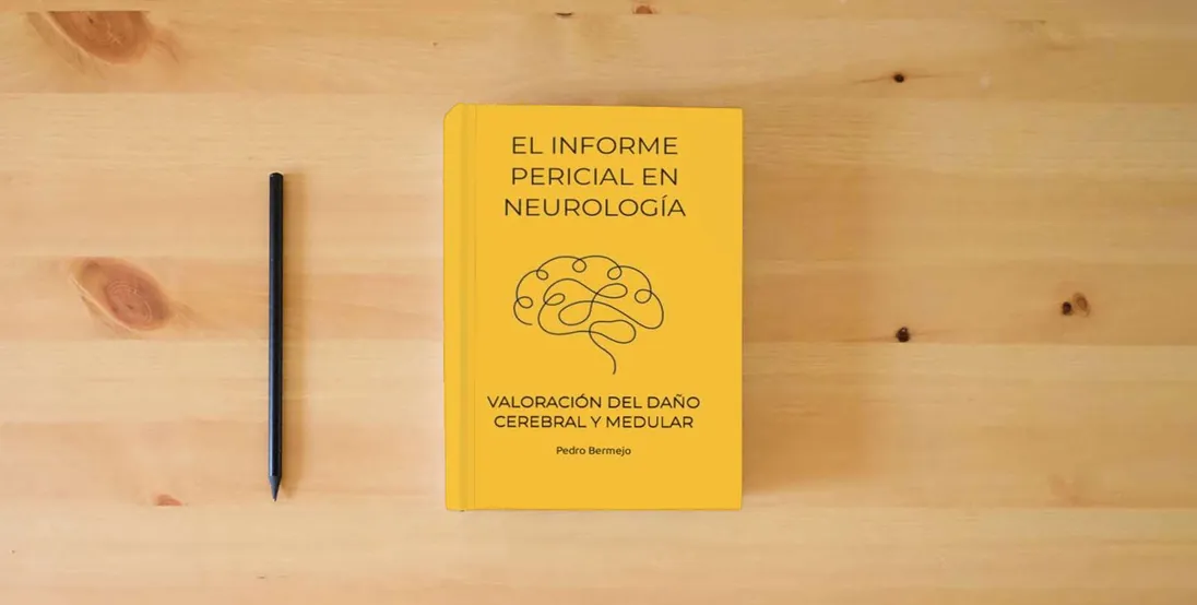 The book EL INFORME PERICIAL EN NEUROLOGÍA: VALORACIÓN DEL DAÑO CEREBRAL Y MEDULAR} is on the table
