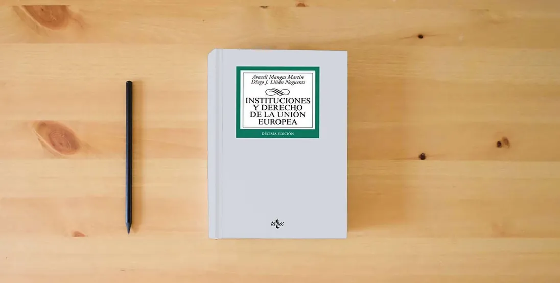 The book Instituciones y Derecho de la Unión Europea (Derecho - Biblioteca Universitaria de Editorial Tecnos)} is on the table