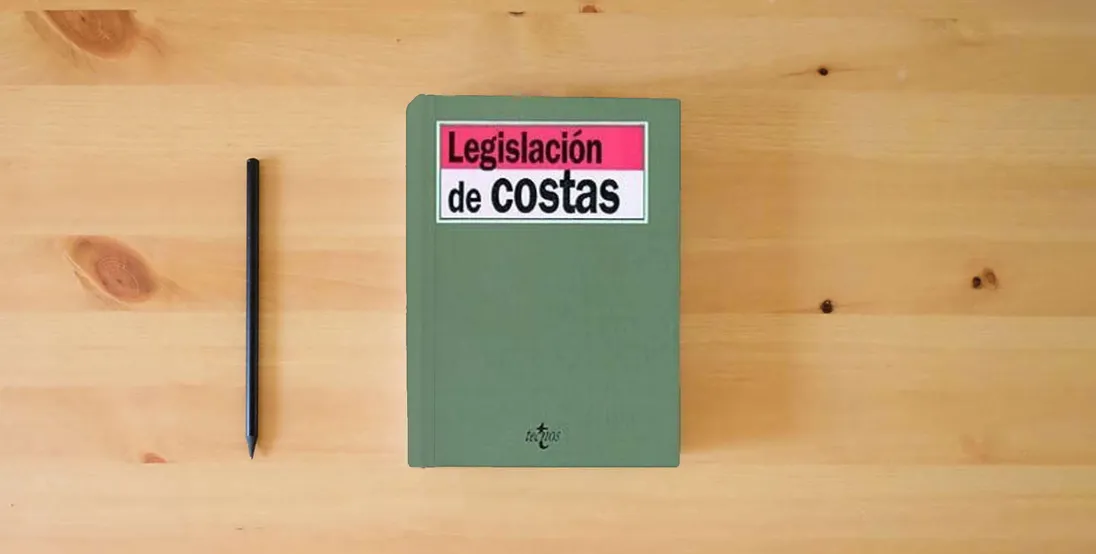 The book LEGISLACION DE COSTAS (SIN COLECCION)} is on the table