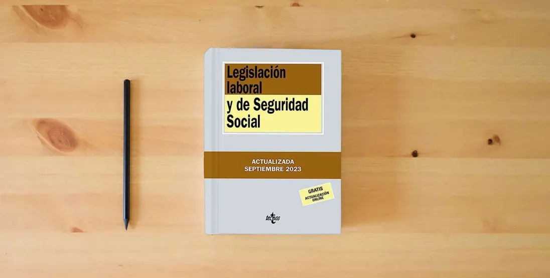 The book Legislación laboral y de Seguridad Social (Derecho - Biblioteca de Textos Legales)} is on the table
