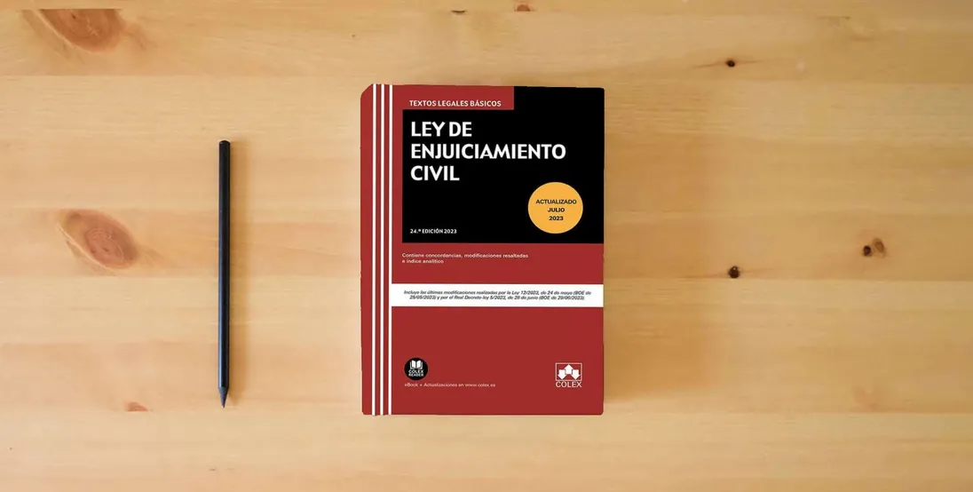 The book Ley de Enjuiciamiento Civil: Contiene concordancias, modificaciones resaltadas e índice analítico (Textos legales básicos)} is on the table
