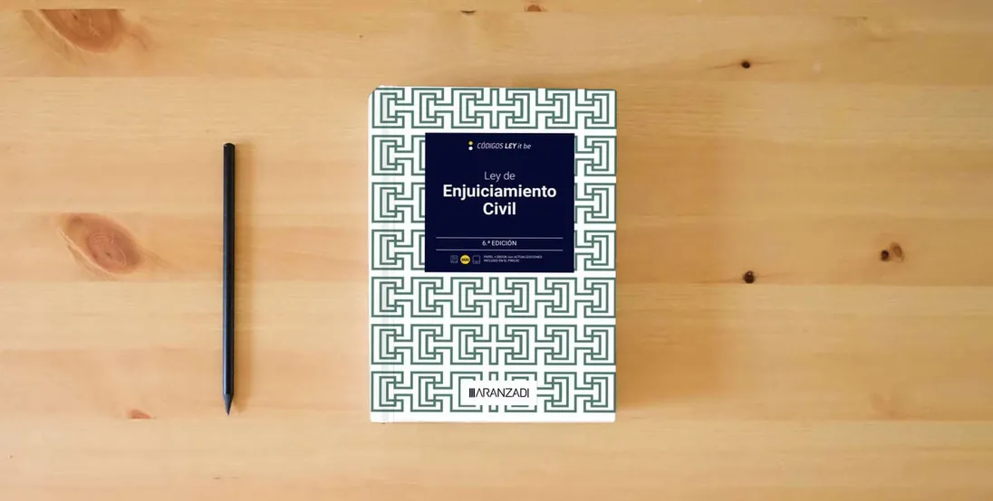 The book Ley de Enjuiciamiento Civil (LeyItBe) (Código Básico)} is on the table