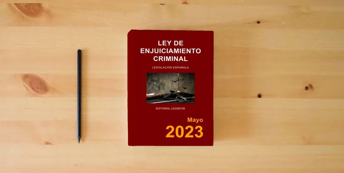 The book Ley de Enjuiciamiento Criminal} is on the table