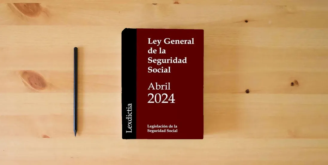 The book Ley General de la Seguridad Social} is on the table
