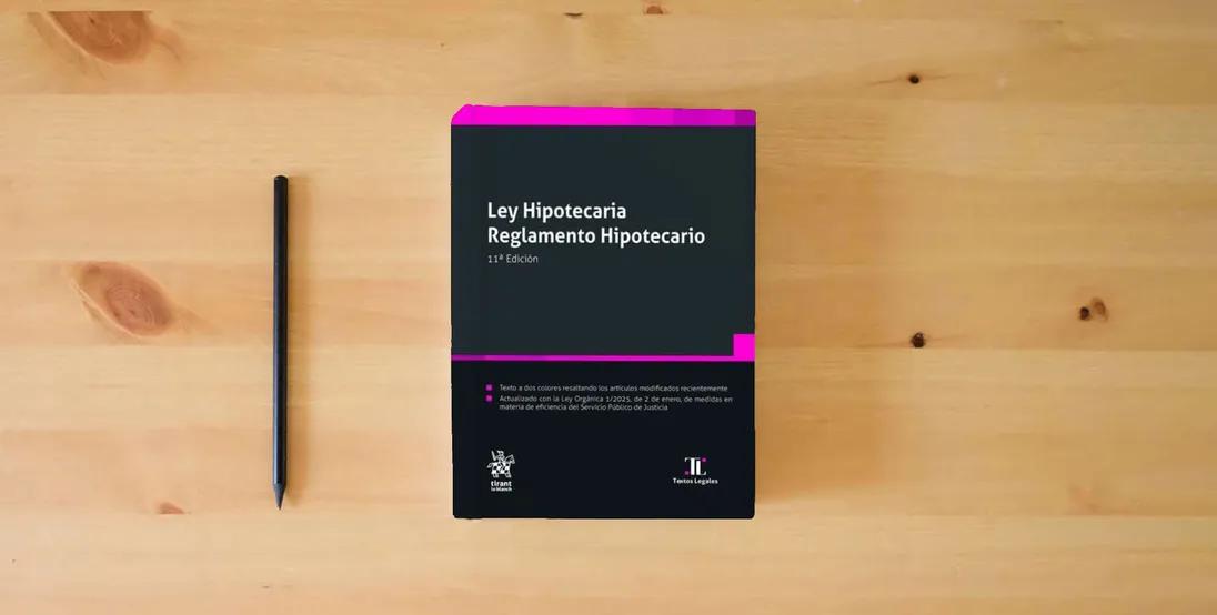The book Ley Hipotecaria. Reglamento Hipotecario 11ª Edición (Textos legales)} is on the table