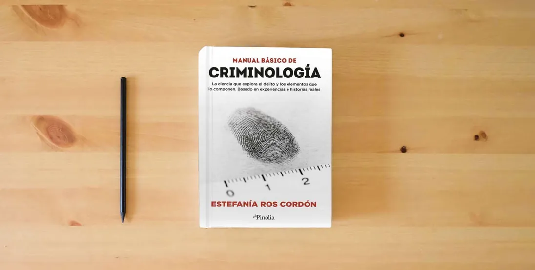 The book Manual básico de criminología (Manuales prácticos)} is on the table