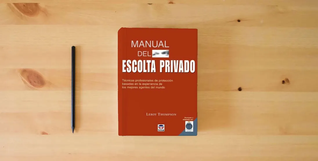 The book Manual Del Escolta Privado. Técnicas Profesionales de Protección (DEPORTES)} is on the table