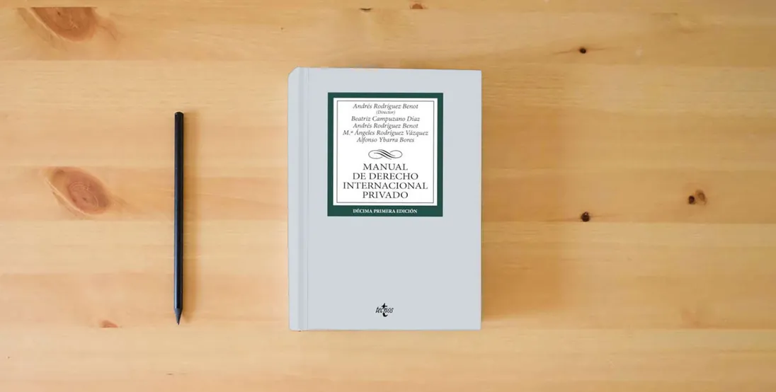 The book Manual de Derecho Internacional privado (Derecho - Biblioteca Universitaria de Editorial Tecnos)} is on the table