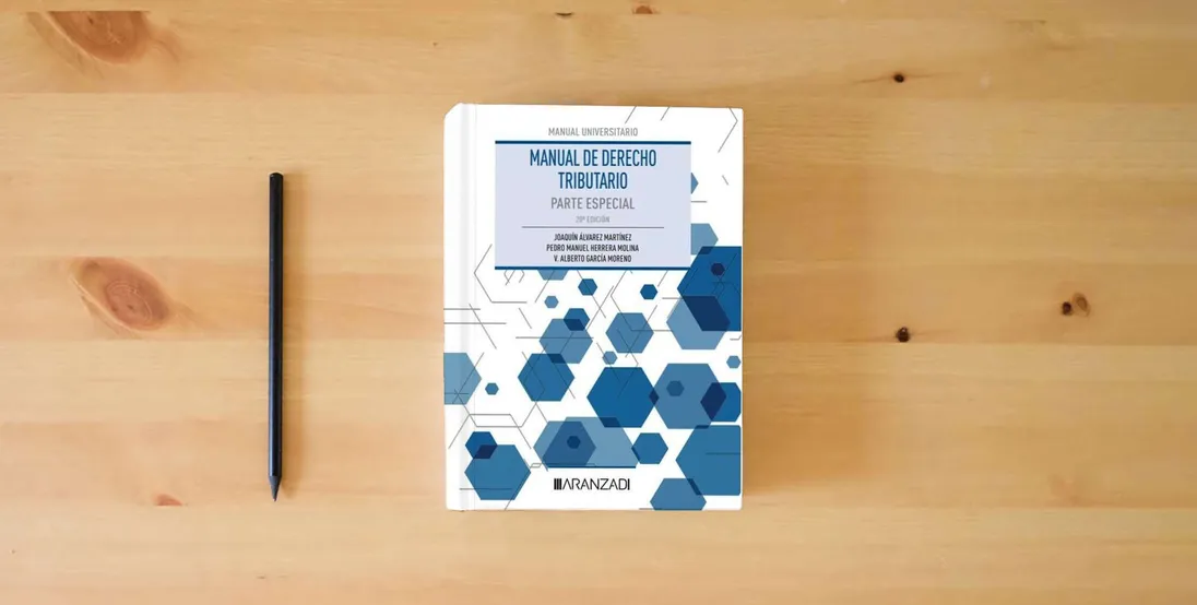 The book Manual de Derecho Tributario. Parte Especial (Manuales)} is on the table