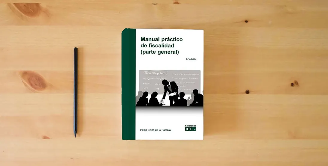 The book Manual Práctico de fiscalidad (parte general)} is on the table