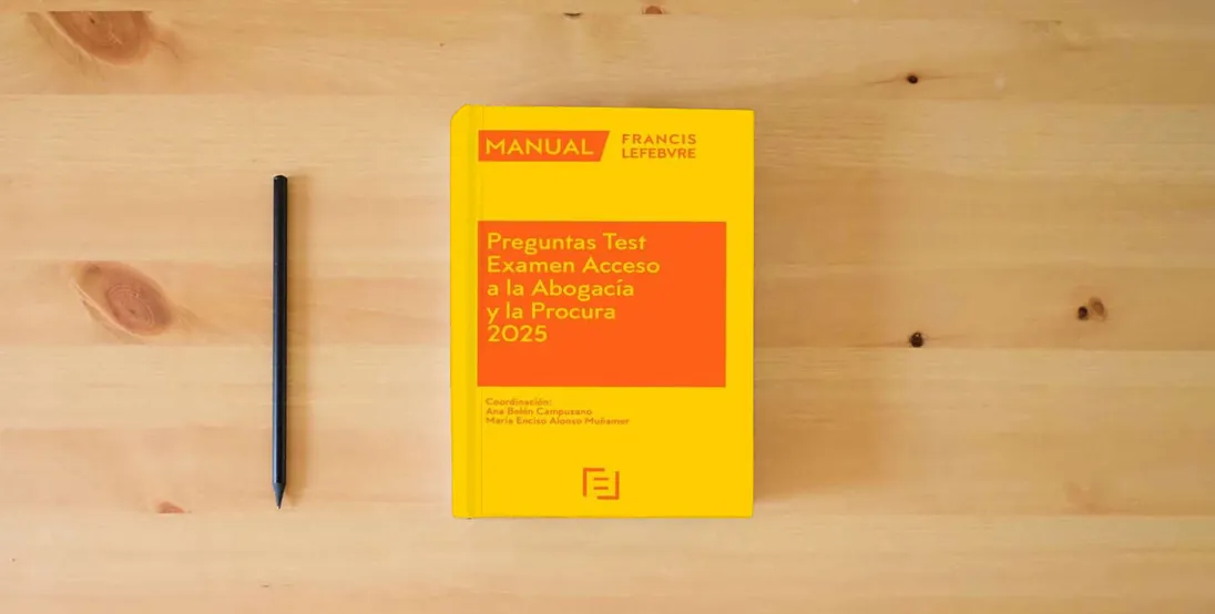 The book Manual Preguntas Test Acceso a la Abogacía y la Procura 2025} is on the table