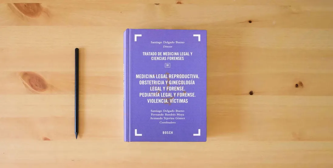 The book Medicina Legal Reproductiva. Obstetricia Y Ginecologia Legal Y Forense: Tomo IV: 4 (Tratado de Medicina Legal y Ciencias Forenses)} is on the table