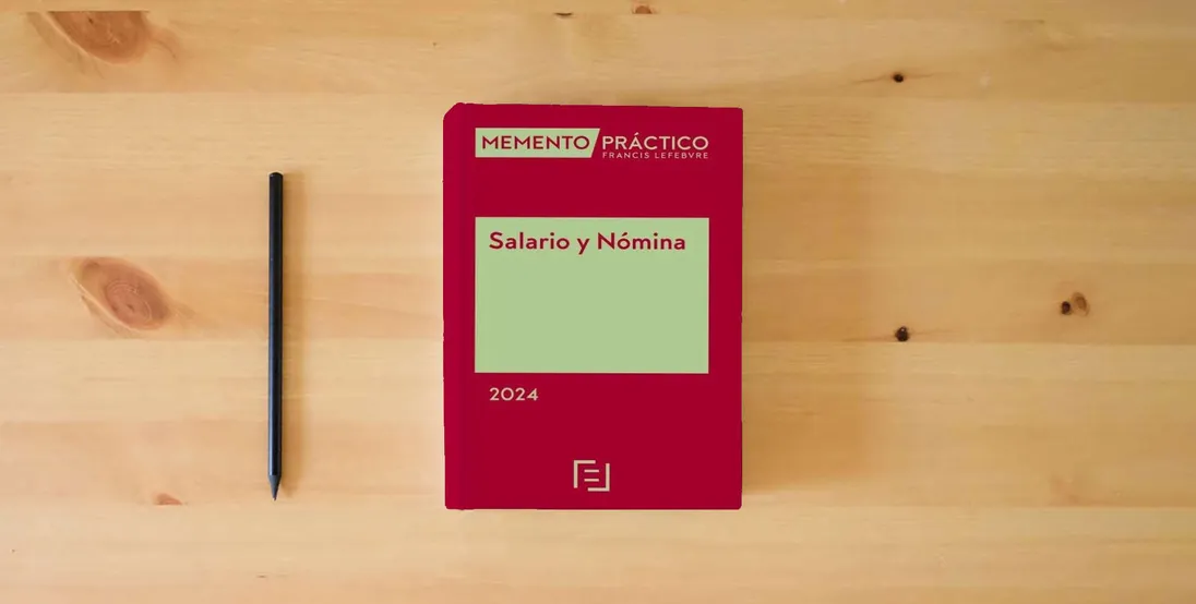 The book Memento Salario y Nómina 2024 (MANUALES)} is on the table