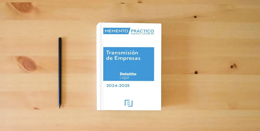 The book Memento Transmisión de Empresas 2024-2025 (MANUALES)} is on the table