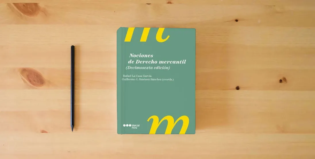 The book Nociones de Derecho mercantil 16.ª ed. (Manuales universitarios)} is on the table