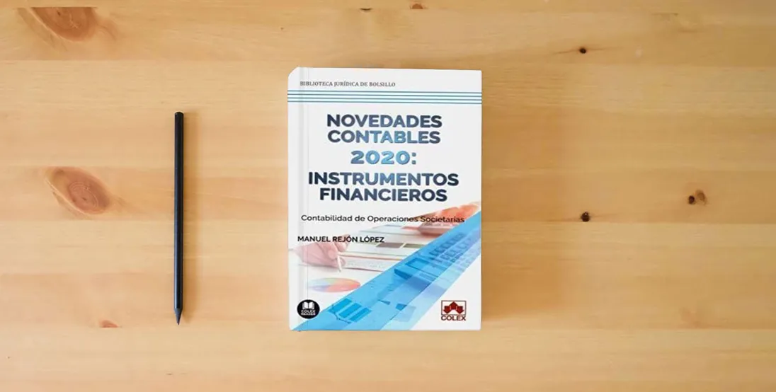 The book Novedades contables 2020: instrumentos financieros: Contabilidad de operaciones societarias: 1 (Bolsillo)} is on the table