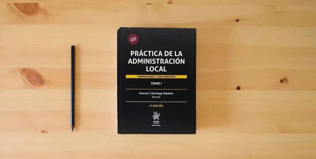 The book Práctica de la Administración Local: Formularios y Documentos 2 Tomos: 1} is on the table