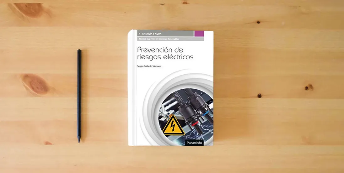 The book PREVENCION DE RIESGOS ELECTRICOS (ENERGIA Y AGUA)} is on the table