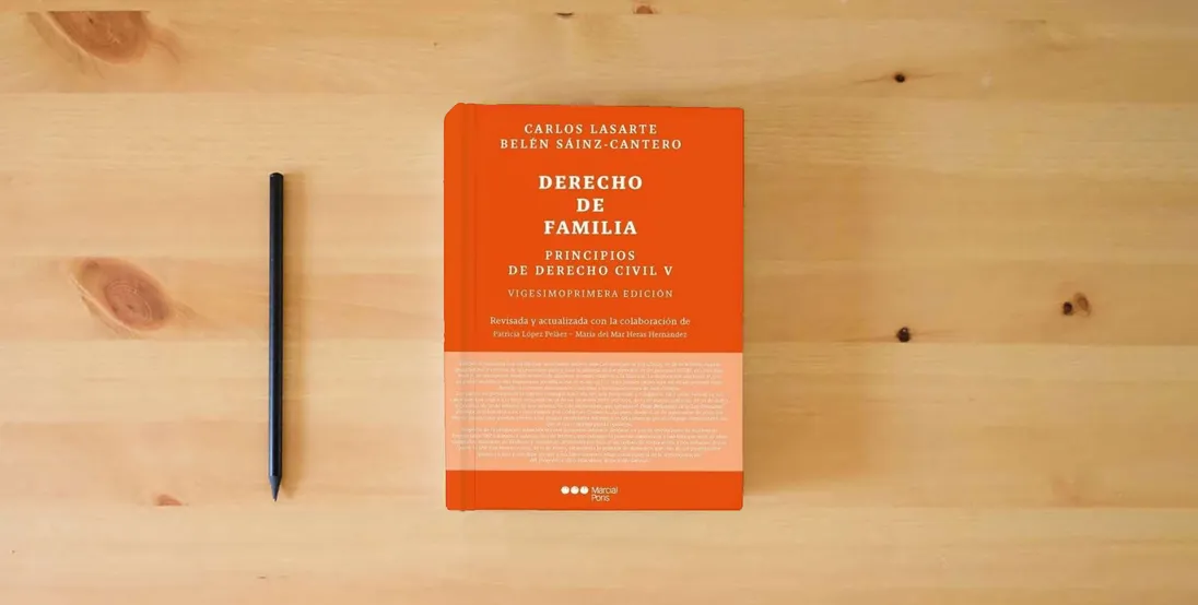 The book Principios de Derecho civil T.V: Tomo V: Derecho de familia 21ª ed. (Manuales Universitarios)} is on the table