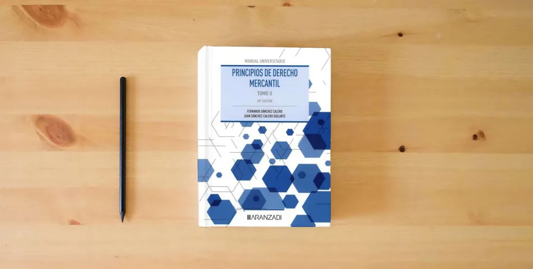 The book Principios de Derecho Mercantil (Tomo II) (Manuales)} is on the table