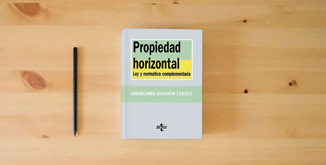 The book Propiedad horizontal: Ley y normativa complementaria (Derecho - Biblioteca de Textos Legales)} is on the table