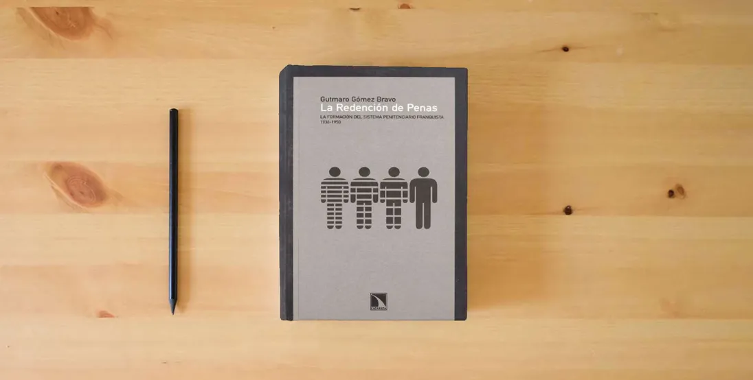 The book Redencion De Penas,La (COLECCION MAYOR)} is on the table