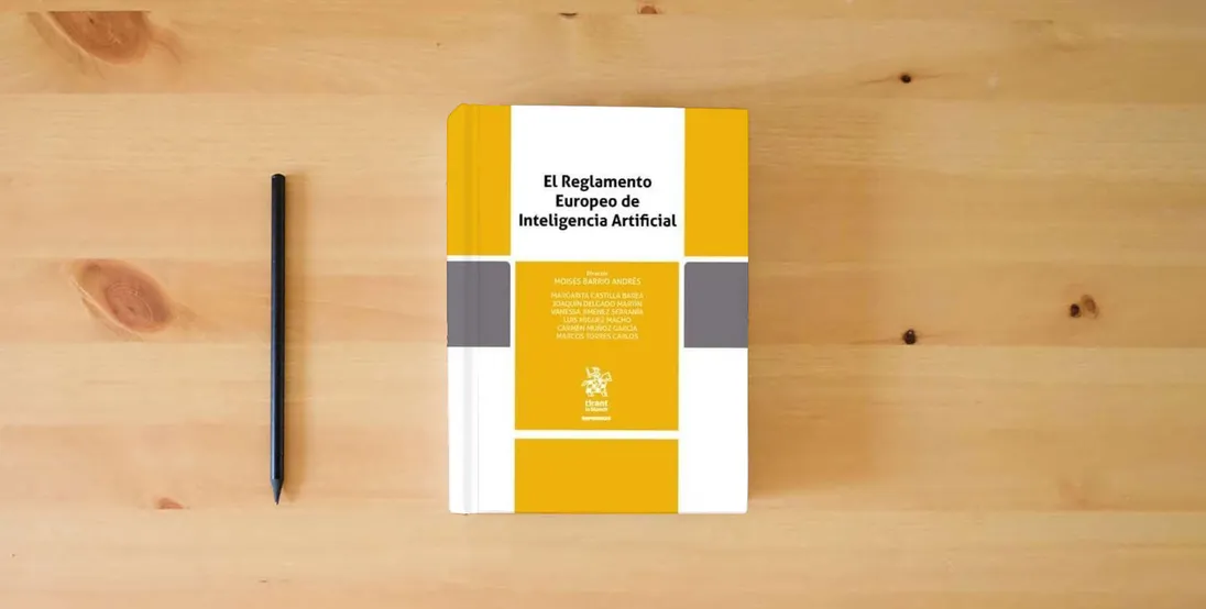 The book El Reglamento Europeo de Inteligencia Artificial (Reformas)} is on the table
