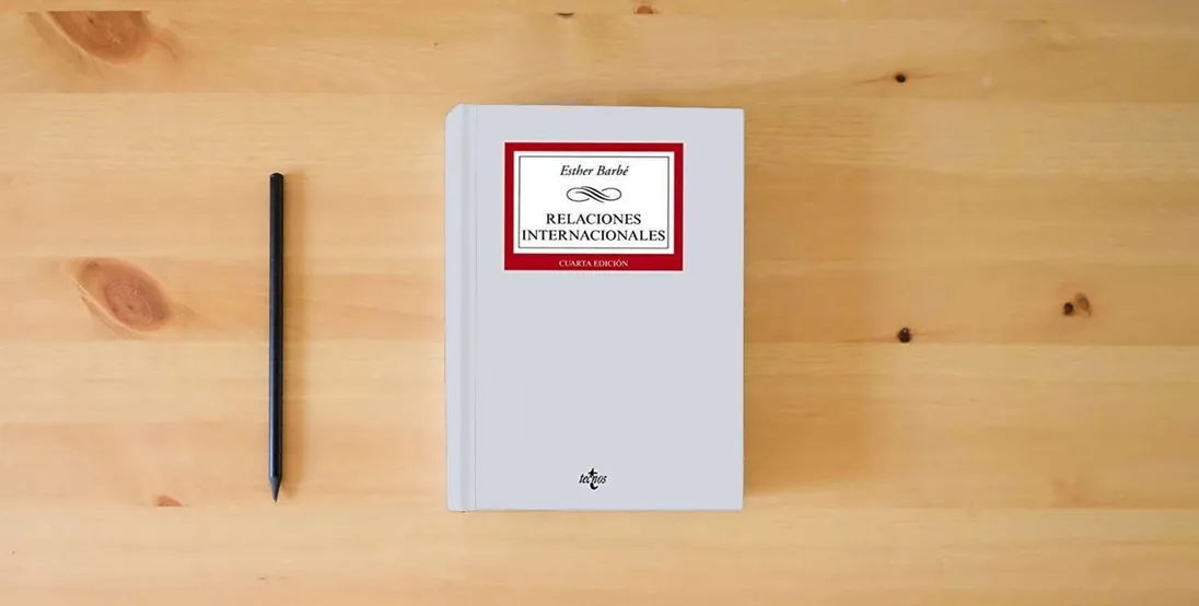 The book Relaciones internacionales (Derecho - Biblioteca Universitaria de Editorial Tecnos)} is on the table