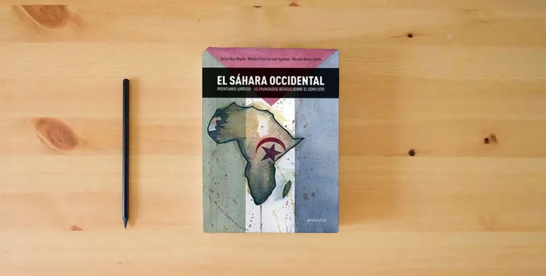 The book SAHARA OCCIDENTAL,EL (FONDO)} is on the table