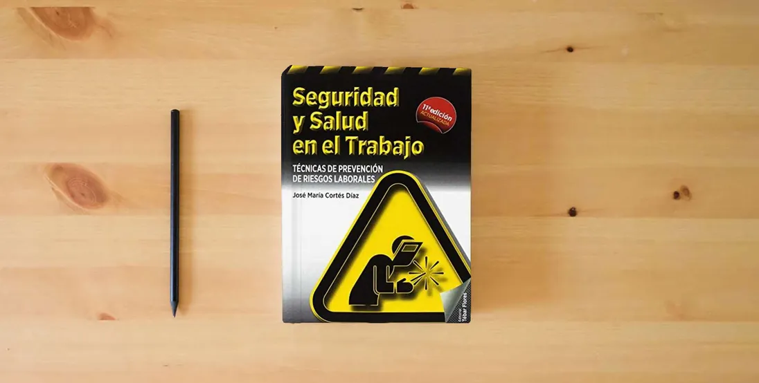 The book Seguridad y salud en el trabajo (11ª ED): Técnicas de prevención de riesgos laborales (SIN COLECCION)} is on the table