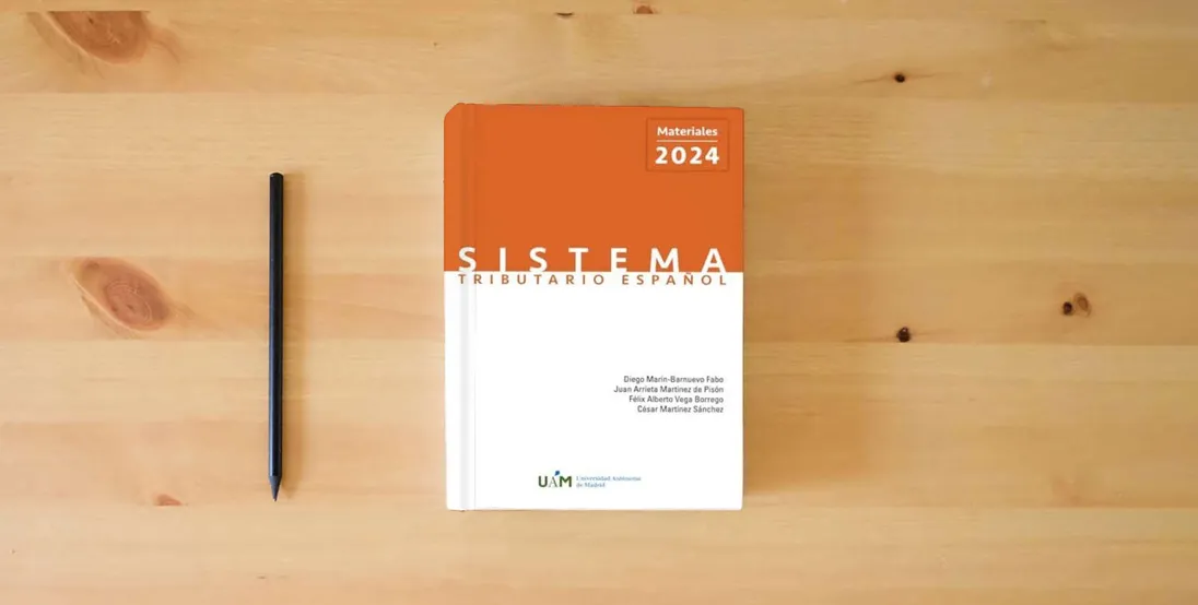 The book Sistema Tributario Español. Materiales 2024} is on the table