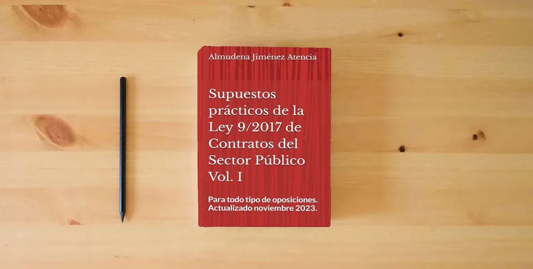 The book Supuestos prácticos de la Ley 9/2017 de 8 de noviembre, de Contratos del Sector Público. Volumen I} is on the table