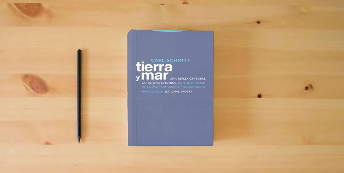 The book Tierra Y Mar. Una Reflexión Sobre La Historia Universal (ESTRUCTURAS Y PROCESOS - DERECHO)} is on the table