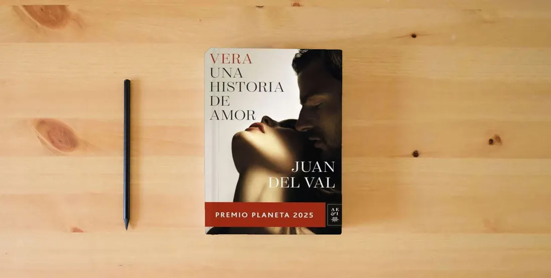 The book Vera, una historia de amor: Premio Planeta 2025 (Autores Españoles e Iberoamericanos)} is on the table