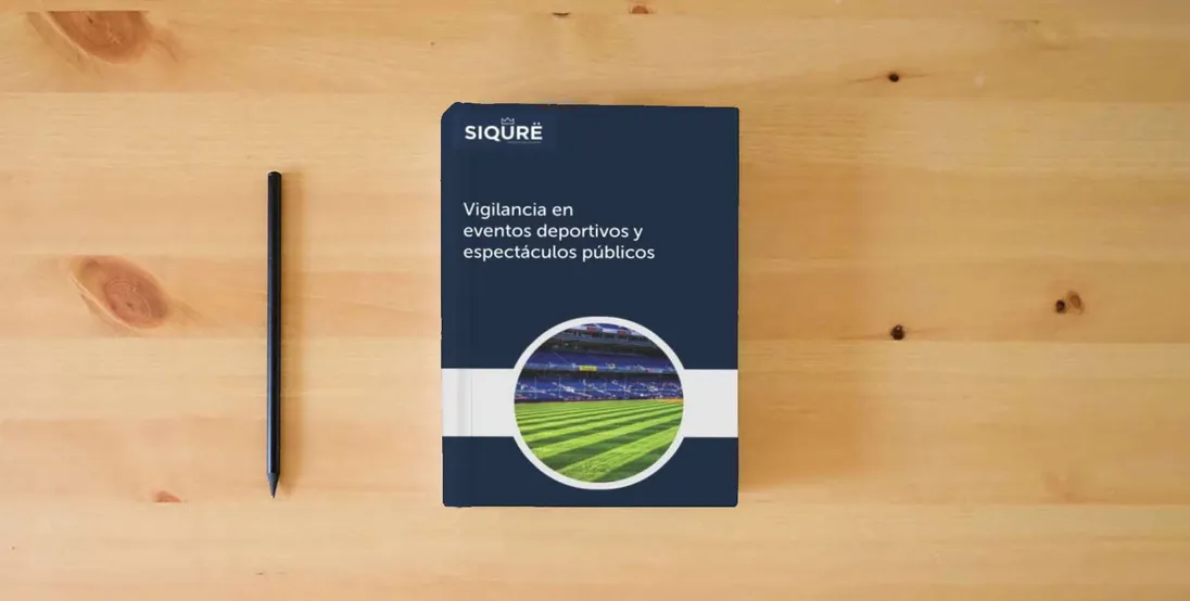 The book Vigilancia en eventos deportivos y espectáculos públicos (Security)} is on the table