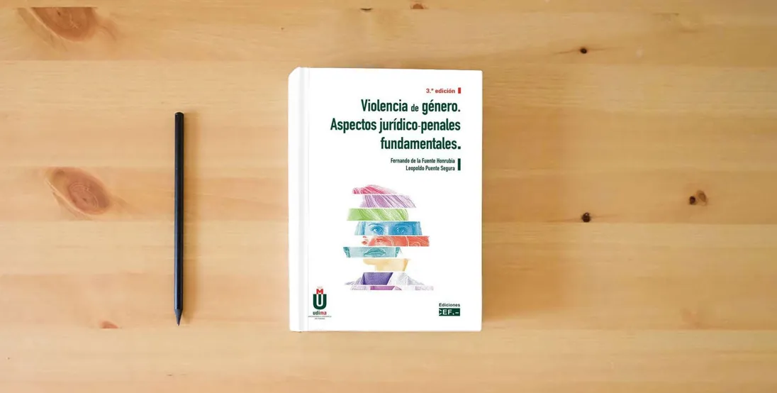 The book Violencia de género. Aspectos jurídico-penales fundamentales (SIN COLECCION)} is on the table