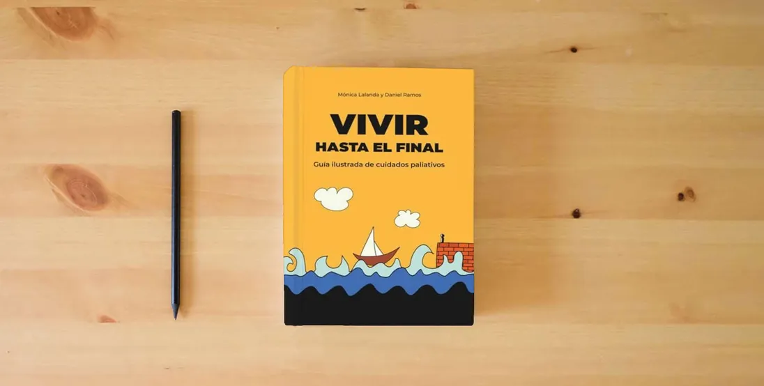 The book Vivir hasta el final: Guía ilustrada de cuidados paliativos} is on the table