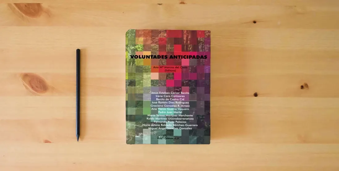 The book Voluntades anticipadas (SIN COLECCION)} is on the table